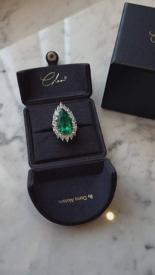 Vibrant Emerald Pear Cut Ring Surrounded by Lab-Grown Diamonds